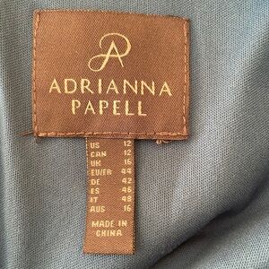 Form fitting. Size 12. Formal gown. Teal in color.